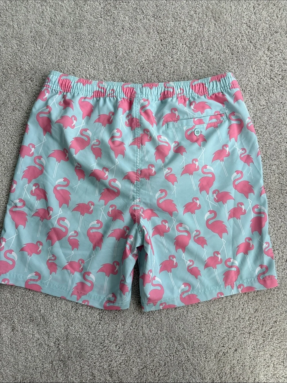 Elysian brand Men’s swim trunks in a blue and pink flamingo print- Size Medium